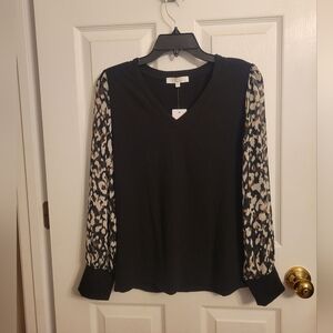 Elegant Black Top with Patterned Sleeves